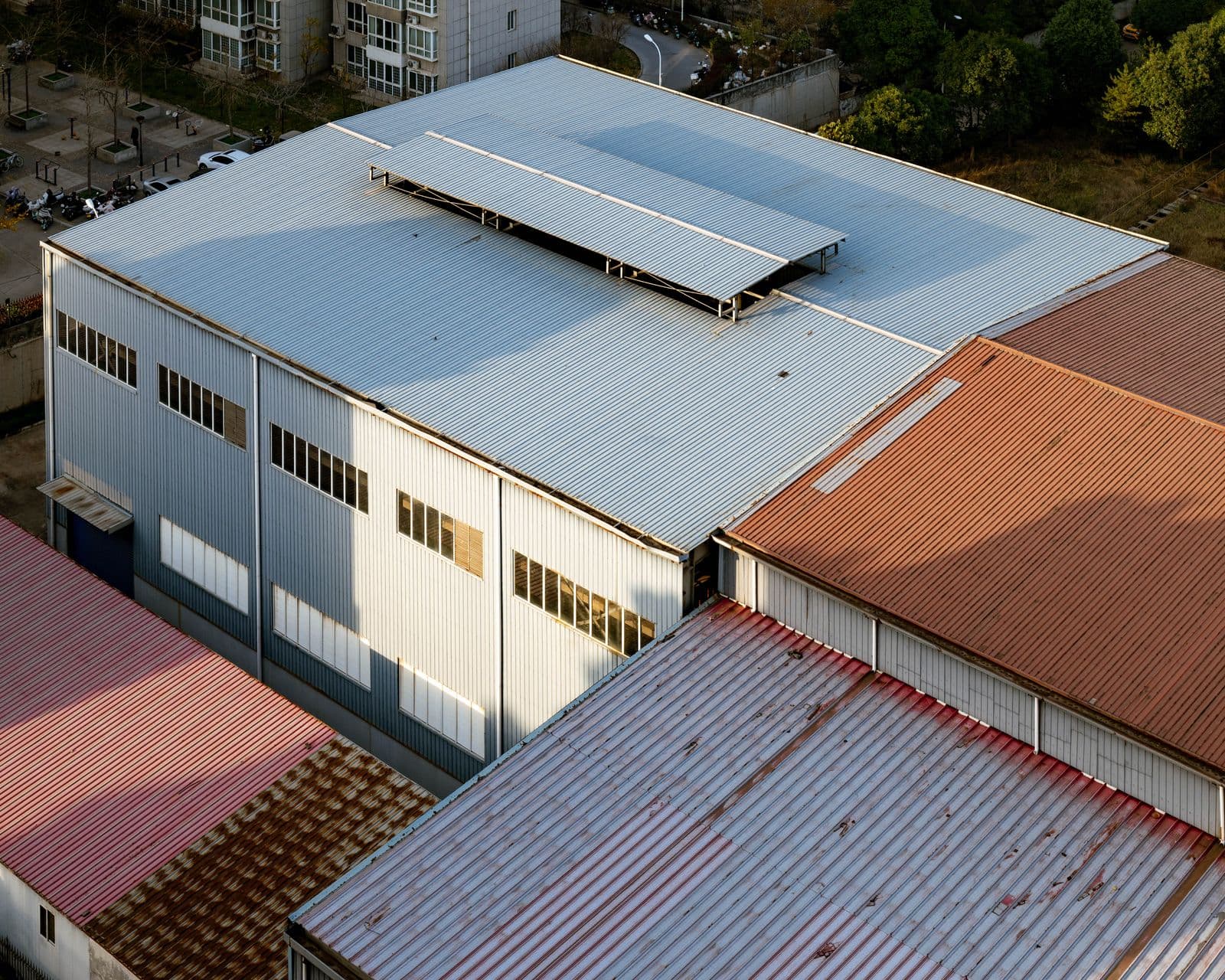 Aerial view of adjoining commercial rooftops across an industrial estate