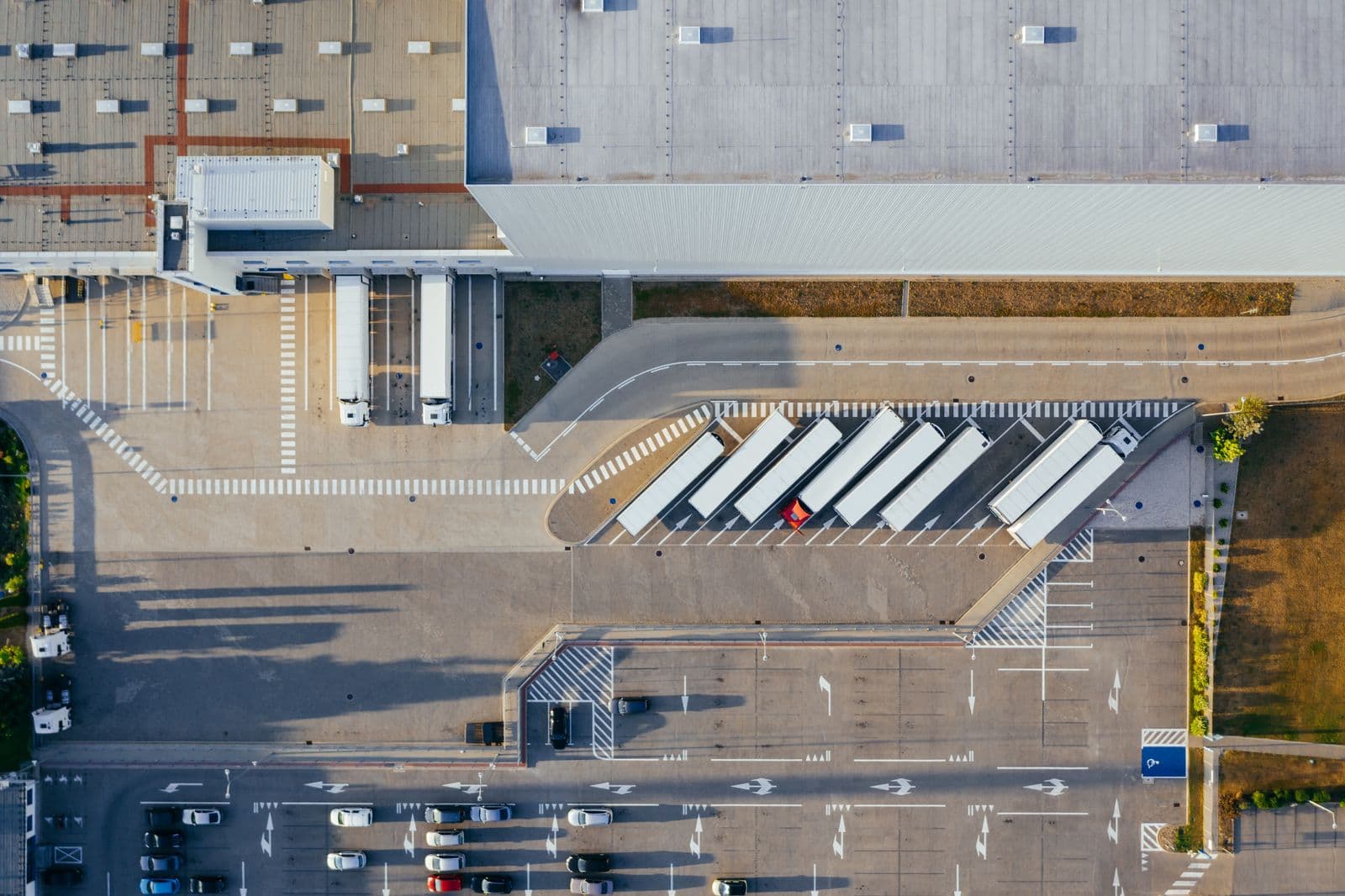 Overhead view of a commercial building and its car park, as used for roof measurement