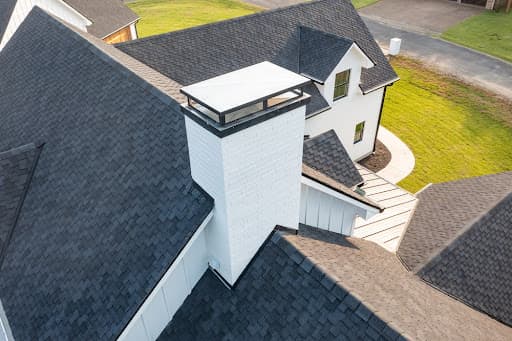 Aerial view of a completed asphalt shingle roof