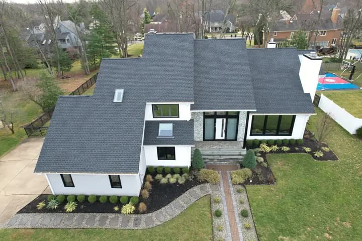 Modern home with a new dark asphalt shingle roof