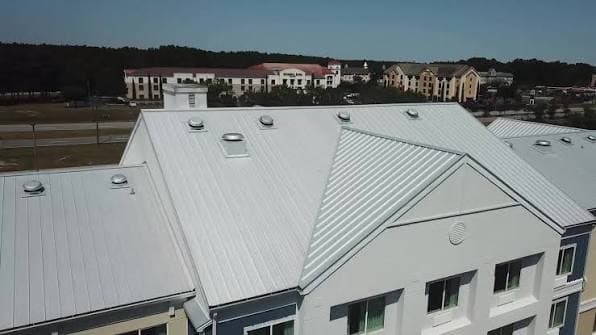 Completed commercial standing-seam metal roof by Roofing Direct