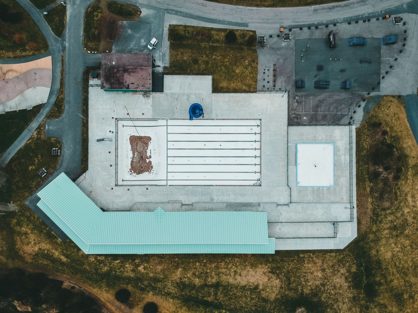 Overhead view of a large institutional flat roof during a condition survey