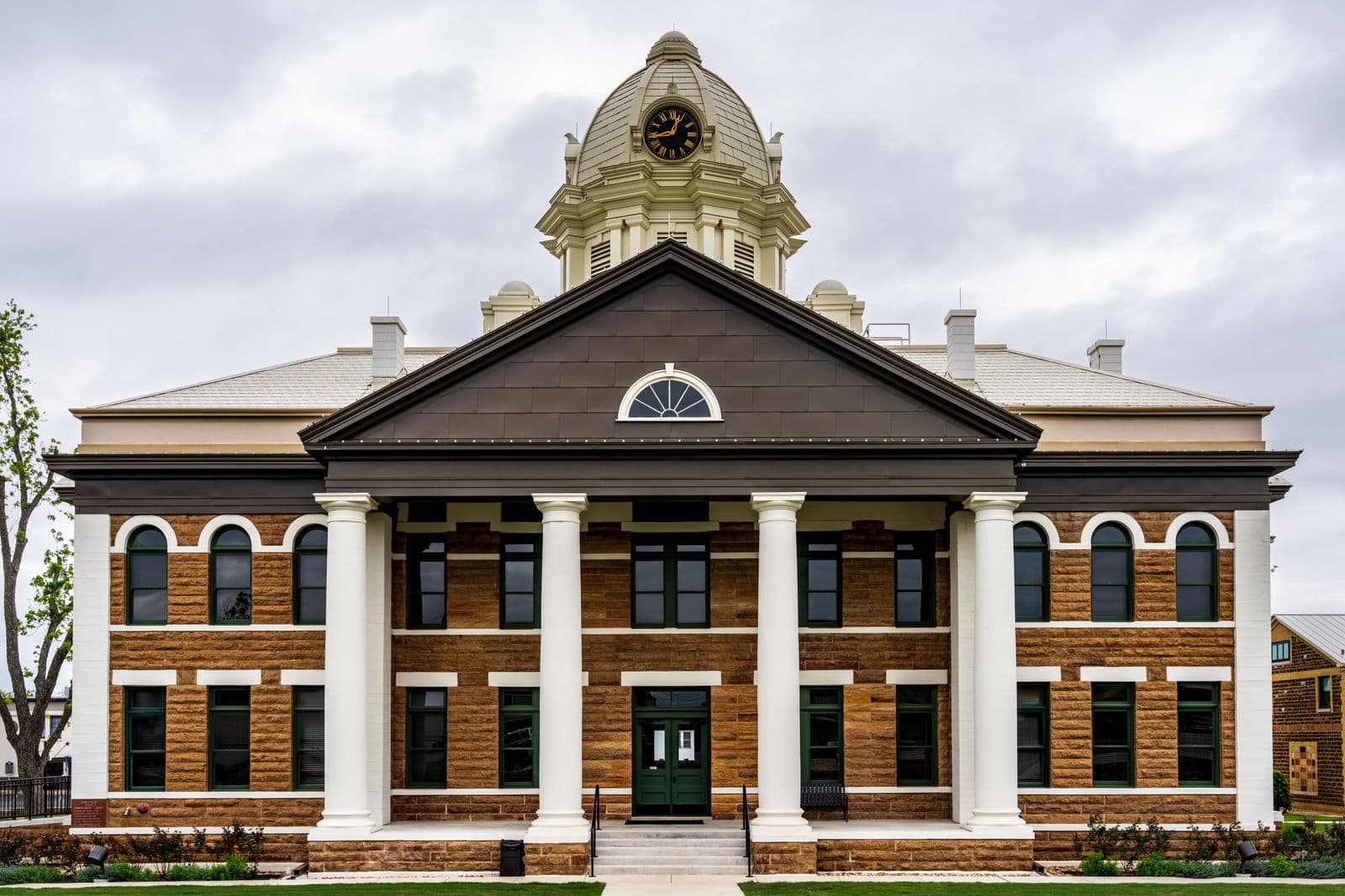 Columned civic courthouse building representing public procurement compliance