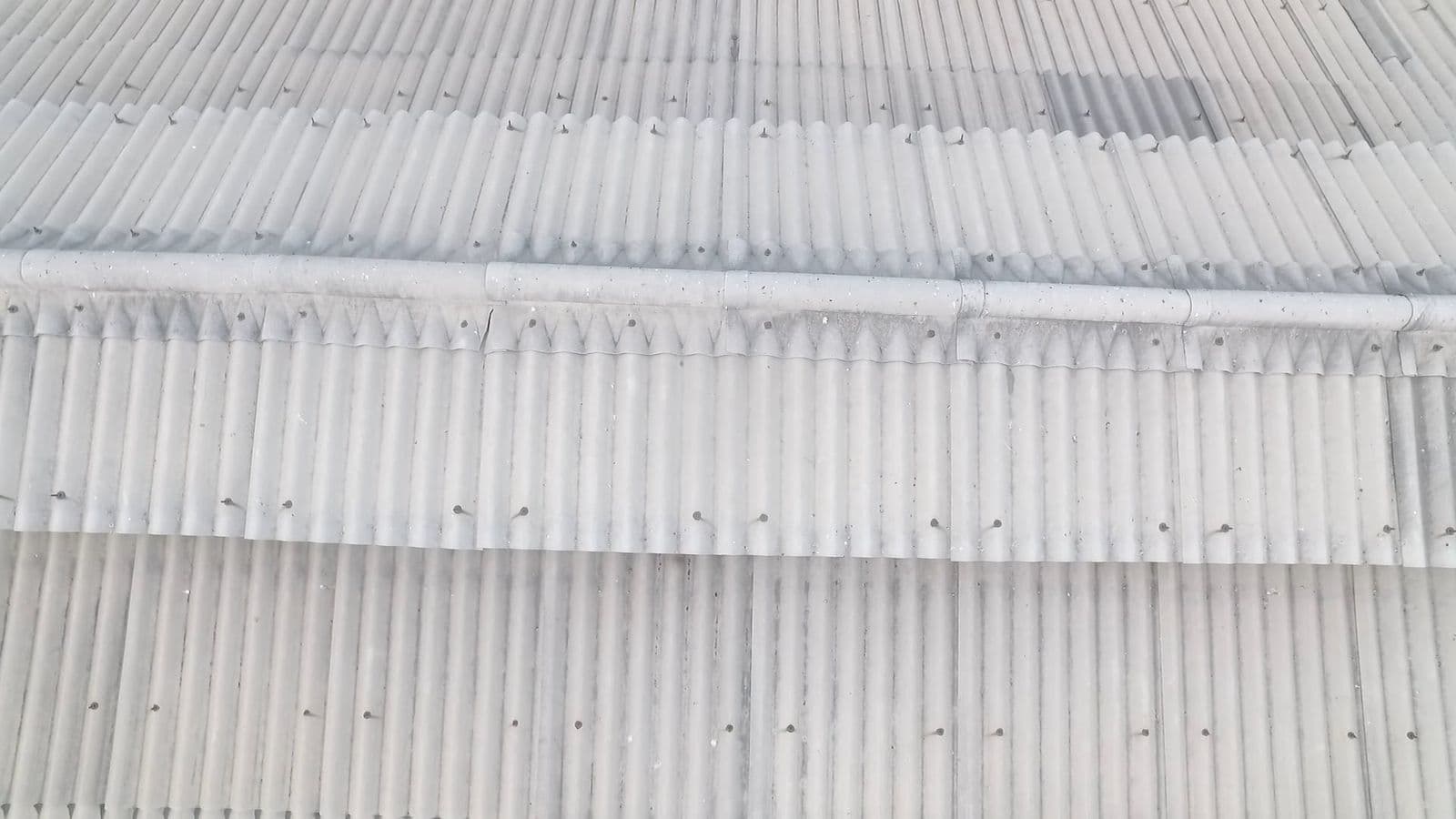 Aerial pass over a ribbed metal sheet roof